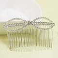 Macro view of rhinestone bow hair comb with silver metal teeth for bridal styling - Silver (C6331)