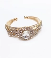 Detail showing luxurious gold multi-layer bracelet with center crystal flower cluster - Oval Decorative Style / Gold