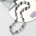 Tahiti mixed grey pearl necklace with zircon-encrusted clasp on reflective surface - 10mm Pearl / Short Length (45cm)