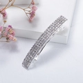 Close-up of sparkling silver rhinestone hair clip with spring closure on white surface - Silver 4-Row (B9230)