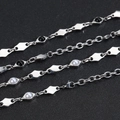 Detail of silver stainless steel chain bracelet with diamond shapes and black obsidian beads - White Artificial Pearl Necklace