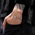Detail of silver steel cross bracelet with white enamel inlay on black denim - Chain Style / 17+5cm / White Spliced Cross (PG0695)