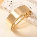 Minimalist wide matte gold curved ponytail hair clip on a natural stone background - Gold