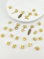 Golden hair braid accessories set with hollow metal rings and diverse charms details - Gold