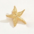 Golden starfish shaped hair clip made of metal with realistic textured finish - Gold Sea Star Style