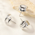 Macro shot of silver irregular geometric stud earrings on a natural stone base - Silver Glossy Streamline Stud Earrings (3#)