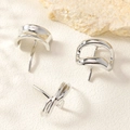 Macro shot of three minimalist irregular geometric silver metal stud earrings on textured base - Silver Irregular Geometric Stud Earrings (2#)