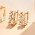 Rose gold huggie earrings with marquise-cut cubic zirconia in a minimalist U-shaped design - Gold
