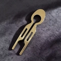 Detail of a minimalist gold U-shaped hair pin on elegant velvet fabric background - Gold