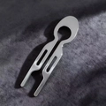 Polished silver U-shaped hair stick with oval hollow design on grey velvet - Silver