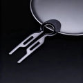 Macro view of minimalist silver U-shaped metal hair pin with black circular top design - Gun Black