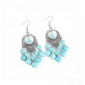 Boucles d'oreilles bohèmes avec perles turquoise et pompons mandala argentés - Boucles d'oreilles / Bleu Turquoise