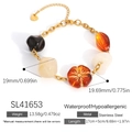 Gold stainless steel bracelet featuring amber resin floral bead and irregular color accents - Beaded Floral Style (SL41653) / Gold