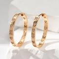 Elegante vergoldete Herz-Creolen mit funkelnden weißen Zirkonia-Steinen für Damen - Gold