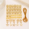 Set de 36 bijoux de cheveux dorés avec pendentifs étoiles, manchettes et cordons fins - Doré
