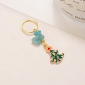 Accessorio capelli dorato con pietra naturale blu e ciondolo albero di Natale smaltato - Pino di Natale