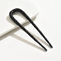 Detailed view of U-shaped hair fork featuring glossy black irregular wave texture finish - U-Shaped Hammered Pattern Style / Black