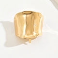 Detailansicht der goldenen Haarklammer mit unregelmäßiger Lava-Textur und Glanz - Gold