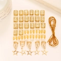 36-piece gold metal hair jewelry set with star pendants and dreadlock cuffs for DIY styling - Gold