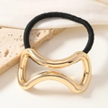 Elegant gold bow hair tie with high-elastic black rope on minimalist stone background - Gold