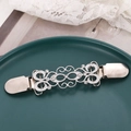 Vintage silver filigree flower cardigan clip with sparkling rhinestones on green ceramic - Silver