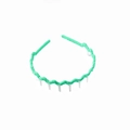 Detailed view of neon green wavy headband with anti-slip teeth and fabric wrapped texture - Light Green