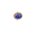 Vintage gold ring featuring a deep blue oval gemstone with a halo of small zircon accents - Sapphire Blue