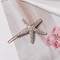 Dettaglio del fermaglio per capelli a stella marina oro rosa con cristalli - Oro rosa