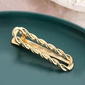 Moderne goldene Haarspange aus Metall mit minimalistischem, gedrehtem Design - Gold