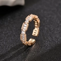 Golden micro-inlaid zircon open ring with rectangular and round cut crystals - Gold