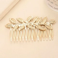 Elegant gold leaf bridal hair comb featuring detailed plant veins and metallic finish - Gold