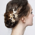 Sparkling gold butterfly hair clips with rhinestones worn on a model for a chic style - Gold Large Flower Marquis Pair