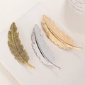 Vintage-Haarklammern in Federform aus Metalllegierung in Bronze, Silber und Gold - Silber