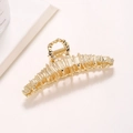Elegante pinza per capelli in metallo dorato con trama a righe e finitura lucida da donna - Oro