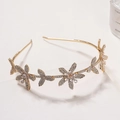 Cerchietto dorato con fiori scintillanti in strass dal design minimalista a cinque petali - Oro