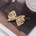 Eleganter goldener Schmetterlings-Haarclip mit funkelnden Strasssteinen auf Magazin - Pave Schleife Stil (F01109-2#)
