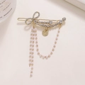 Elegante pinza de pelo con lazo dorado, pedrería y cadenas de perlas colgantes - Lazo