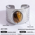 Retro stainless steel cuff bracelet with a large oval tiger eye stone inlay - Tiger Eye Radial Pattern Stainless Steel Bracelet Style (JZ21189S)