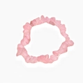 Macro shot of irregular polished pink crystal beads on a natural gemstone bracelet - Pink