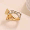 Elegante mini molletta per capelli in metallo dorato con strass bianchi per code - Oro