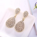 Elegant gold-tone teardrop dangle earrings with sparkling rhinestones in a white tray - Gold (A3216)