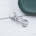 Detailed view of silver alloy geometric hair clip with three rings and duckbill clip back - Silver Circle Style (E2418)