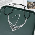 Detailed macro view of silver Gothic multilayer forehead chain with sparkling rhinestones - Triple Ring V-Shape Style (D2421)