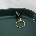 Golden dreadlock ring with a deep blue translucent bead on dark green tray - Dark Blue (F1425-7#)