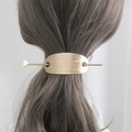 Elegant gold metal hair stick with heart charm and matte oval clip on a ponytail - Gold Brushed (C1117)