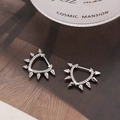 Silver punk heart earrings with rivets and micro zircon on dark magazine background - Silver