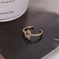 Minimalist gold geometric ring with micro-set zircons in a cross-bar and circle design - Gold (D7204)
