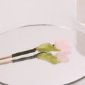 Elegant tulip hair stick for buns with pink petals and green leaves on a mirror - Pink