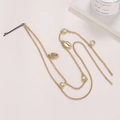 Detail of gold hair chain with metallic shells and pearls on a minimalist background - Shell Pearl Hair Clip (D6426)