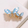 Elegant gold butterfly hair clip with blue enamel and sparkling white crystals - Sky Blue